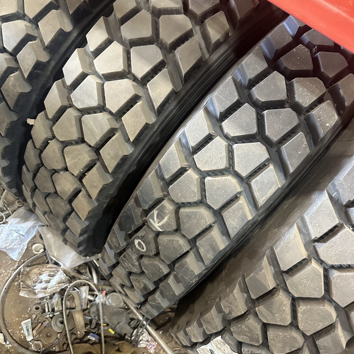 Heavy truck drive tires photographed close up mid-service